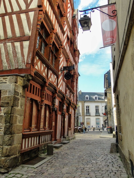 Narrow European Street with Historic Timber Buildings