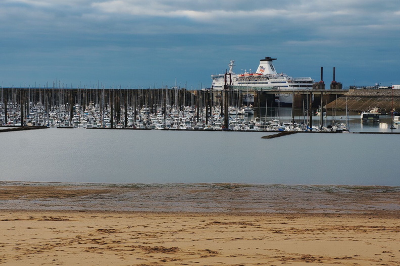 French Coast Harbor: A Serene Scene of a Cruise Ship and Boats Moored in Saint-Malo