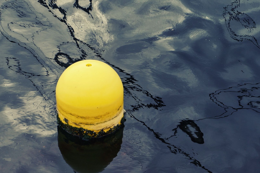 Vibrant Buoy in a Calm River