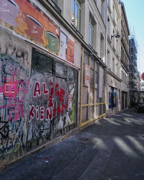 Vibrant Alleyway with Graffiti and Signage in Paris, France