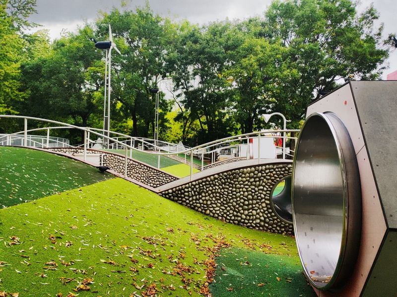 Parisian Art Park: Modern Elevated Walkway with Staircase and Sculpture