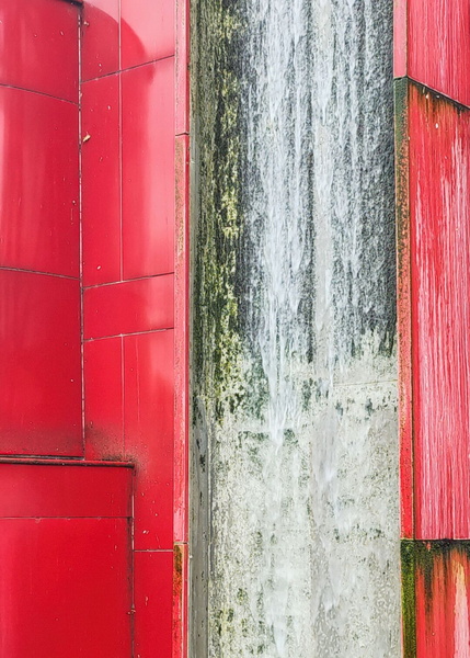 The Elegant Flow: A Red Fountain in Paris