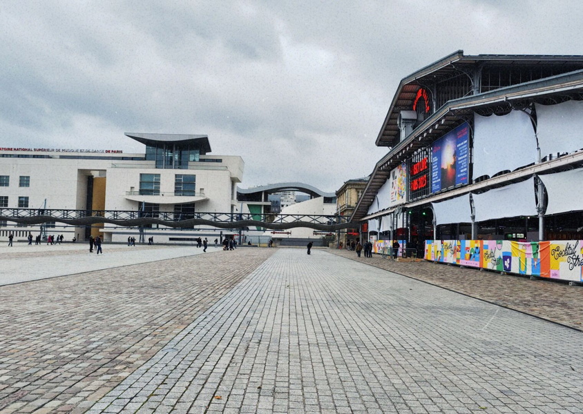 Bustling European Courtyard on a Cloudy Day