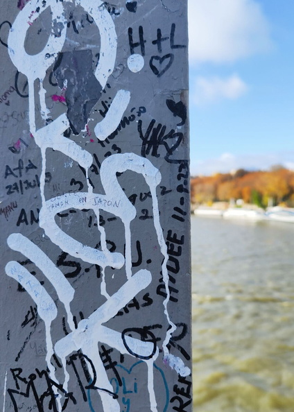 Vandalized Graffiti on Sign Post along River Seine, Paris