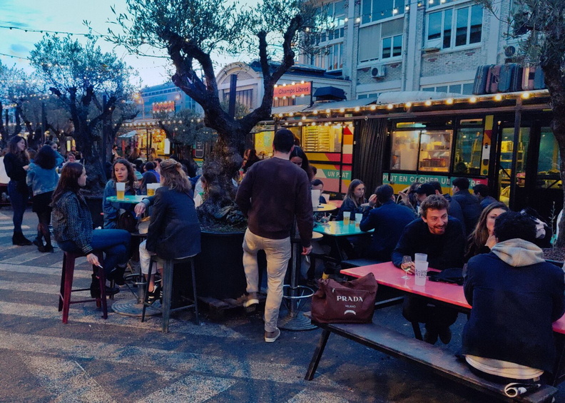 A lively evening at a street food market in Paris, France