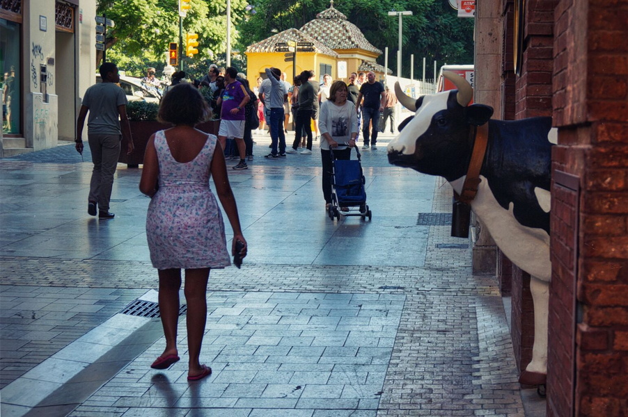 A Woman Walking on a European Street