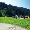 Serene Mountain Bus Stop Under a Clear Blue Sky