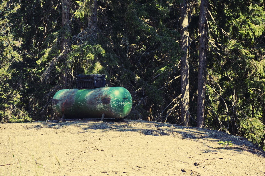 Serene Rural Scene: A Lone Tank in the Forest