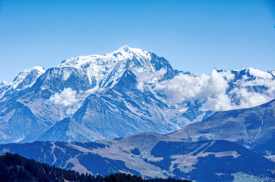 Magnificent Snow-Capped Peak Overlooking a Valley