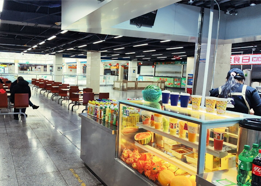 Shenyang Marketplace with a Variety of Food Stalls and Products for Sale