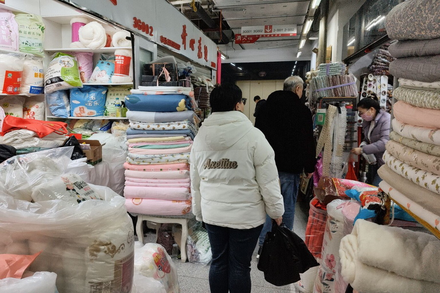 A Shenyang Marketplace: A Vivid Display of Textiles and Household Items