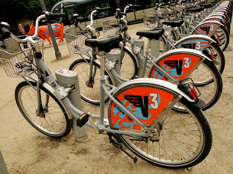 A Rack of Bicycles with Colorful Designs