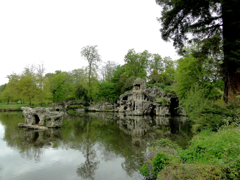 Serene Lake with Ruins: A Picturesque Scene of French Architecture