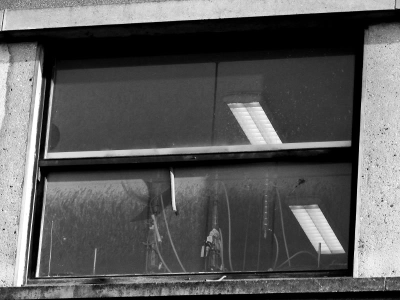 Reflections and Rust in a Bordeaux Window