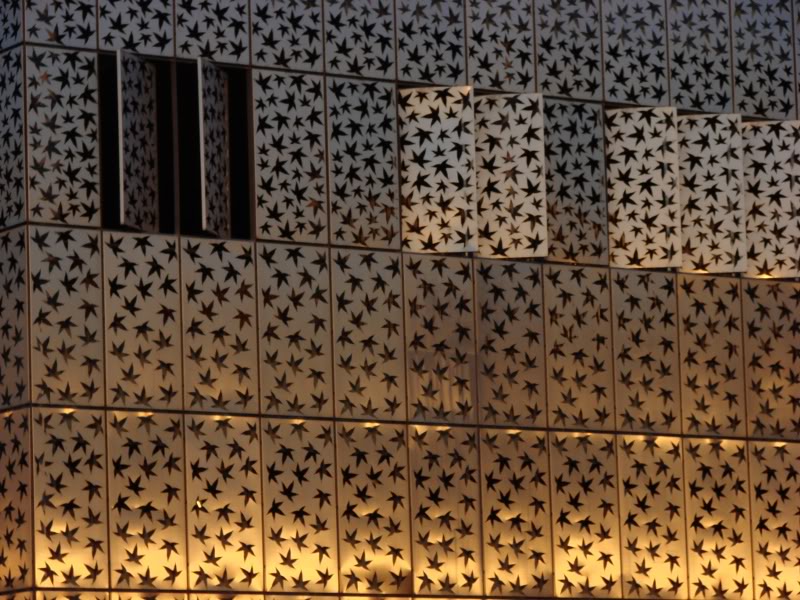 Contemporary Facade with Star Patterns and Lights