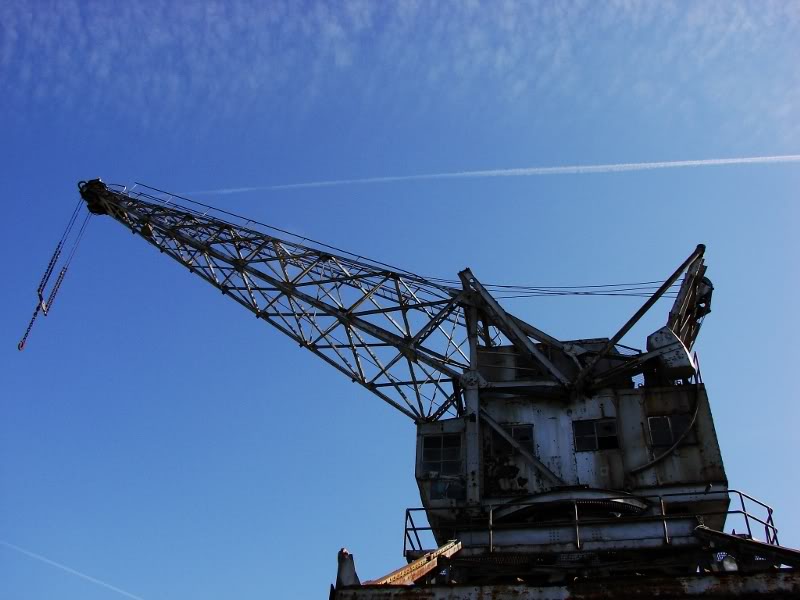 Abandoned Crane Silhouetted Against the Sky