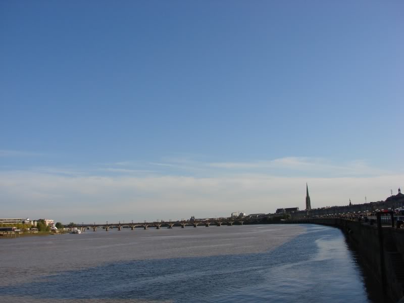 Serene Bordeaux River View with Bridge and Clouds